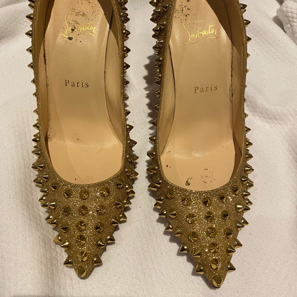 Christian Louboutin gold studded pumps